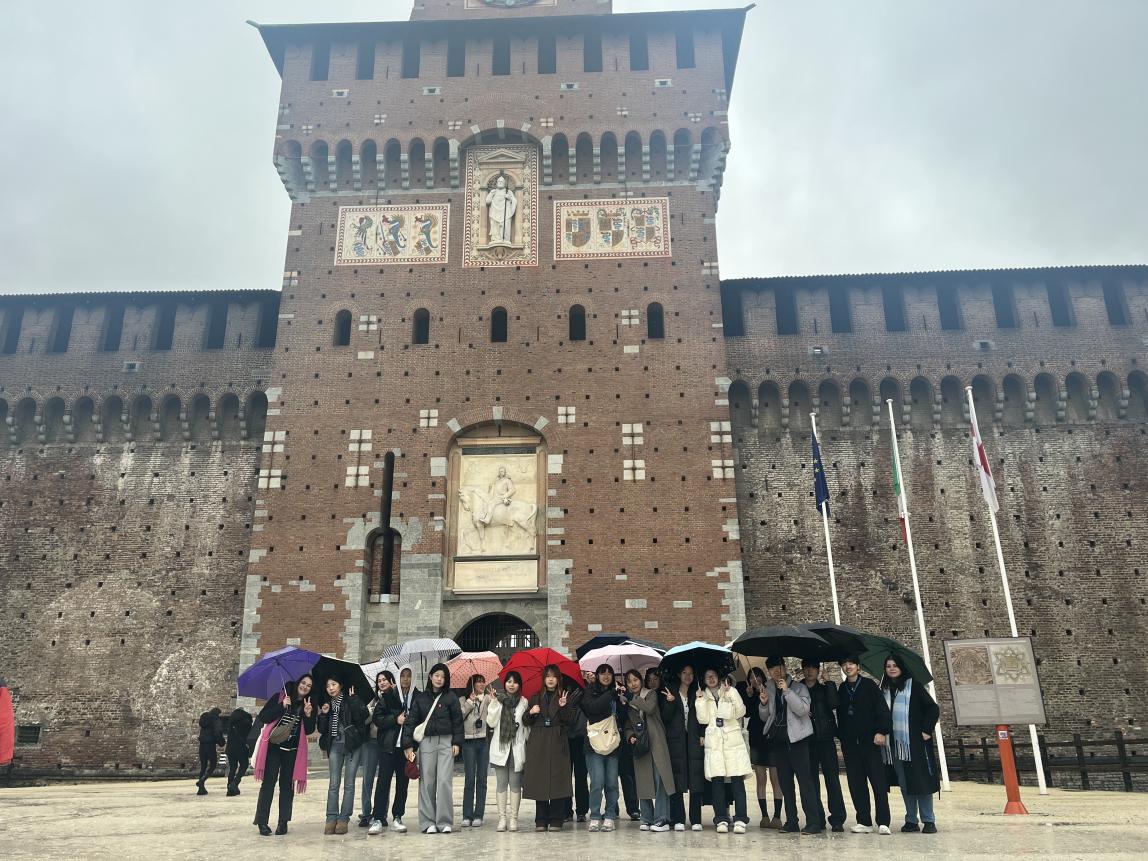 A group of SAF students stand outside Sforzesco Castle in Milan