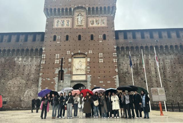 A group of SAF students stand outside Sforzesco Castle in Milan