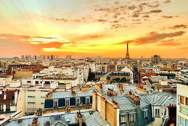 a view of Paris from the rooftop during sunset
