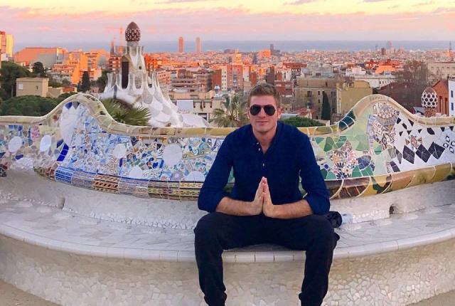 a male student poses for a photo at Park Güell