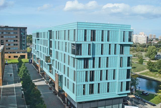 A bright blue building, the France House, sits on the campus of the University of London-Queen Mary.